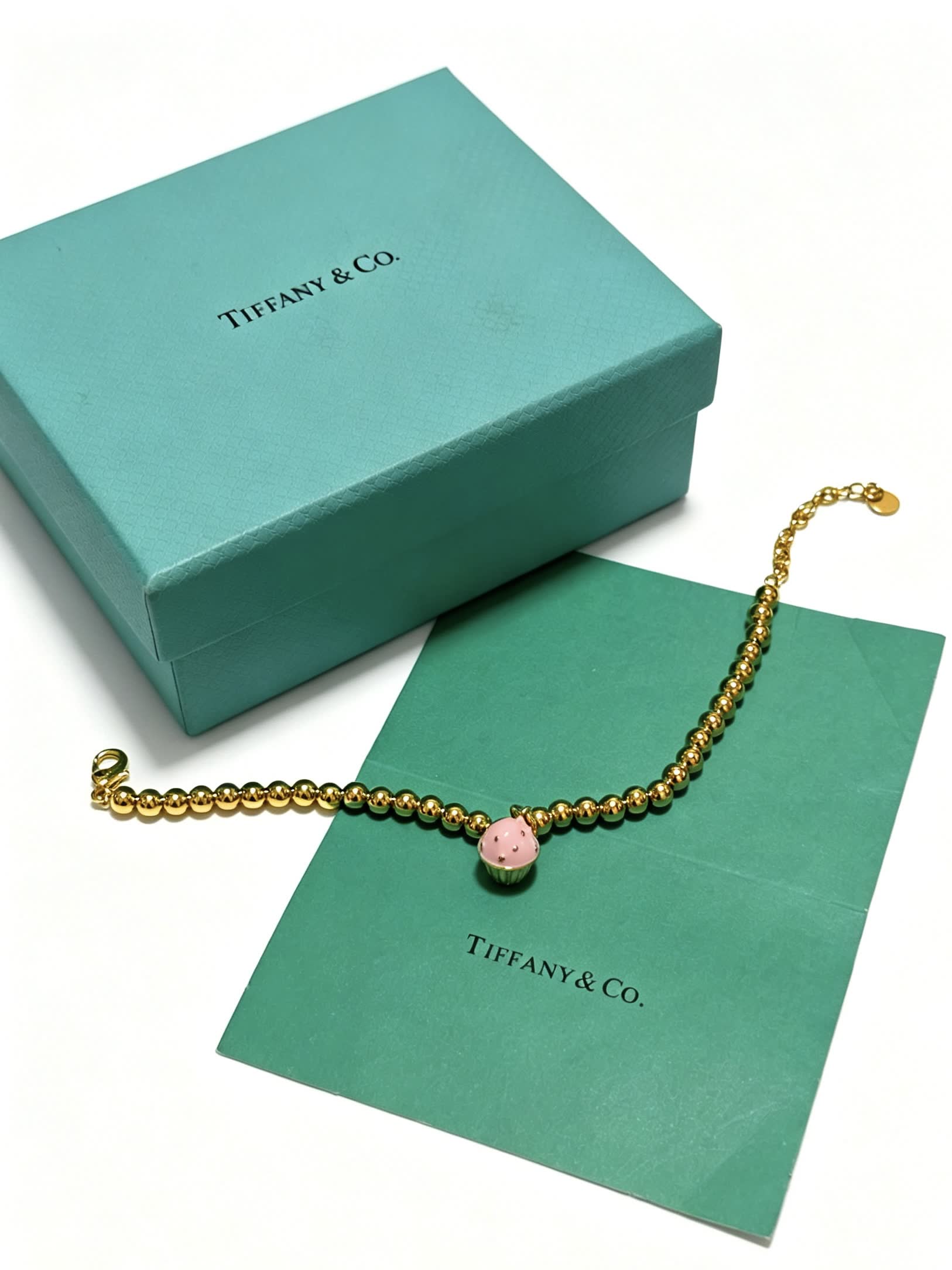 Tiffany & Co. Gold Bead Bracelet with Cupcake Charm